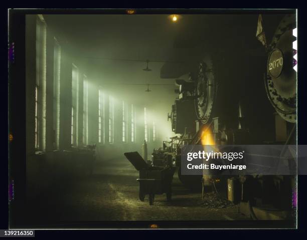 In the roundhouse at a Chicago and Northwestern Railroad yard, Chicago, Illinois, 1942.