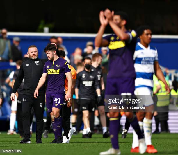 Wayne Rooney, Manager of Derby County, reacts with Eiran Cashin after the final whistle of the Sky Bet Championship match between Queens Park Rangers...