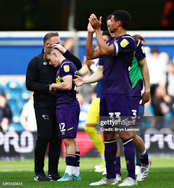 Wayne Rooney, Manager of Derby County, reacts with Liam Thompson of Derby County after the final whistle of the Sky Bet Championship match between...