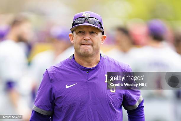 Head Coach Jay Johnson of the LSU Tigers on the field before a game against the Arkansas Razorbacks at Baum-Walker Stadium at George Cole Field on...