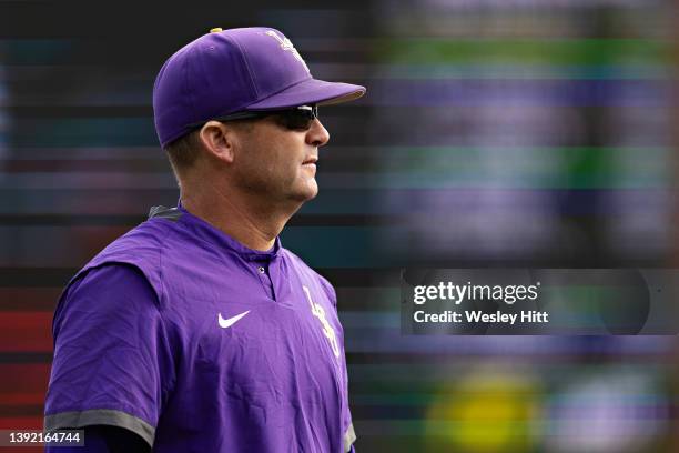 Head Coach Jay Johnson of the LSU Tigers walks to the dugout during a game against the Arkansas Razorbacks at Baum-Walker Stadium at George Cole...