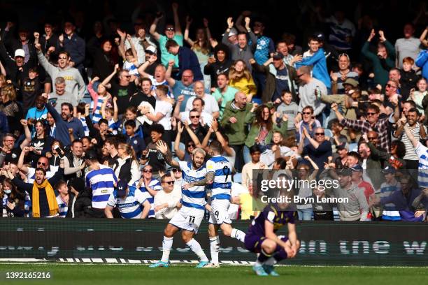 Charlie Austin of Queens Park Rangers celebrates after scoring a goal with teammate Lyndon Dykes which is later disallowed for offside during the Sky...