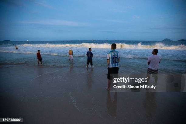 Argentinian fans pee into the ocean on Copacabana beach whilst watching the World Cup Semi Final match between Argentina and Holland on July 9th,...