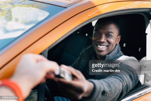 millennial enjoying new car - buying a car stock pictures, royalty-free photos & images