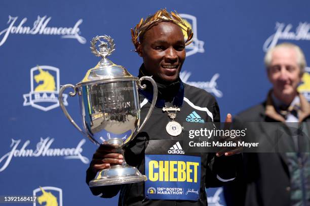 Evans Chebet of Kenya celebrates on the podium after placing first in the professional men's division during the 126th Boston Marathon on April 18,...