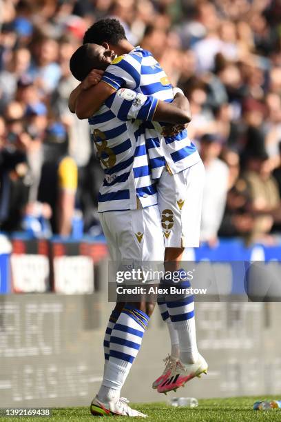 Lucas Joao of Reading celebrates with teammate Josh Laurent after their team's fourth goal during the Sky Bet Championship match between Reading and...