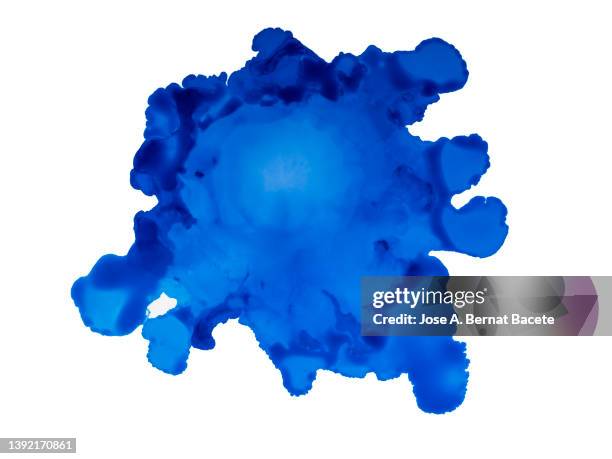 drop of blue paint slides on a blank canvas. - aquarell fleck stock-fotos und bilder