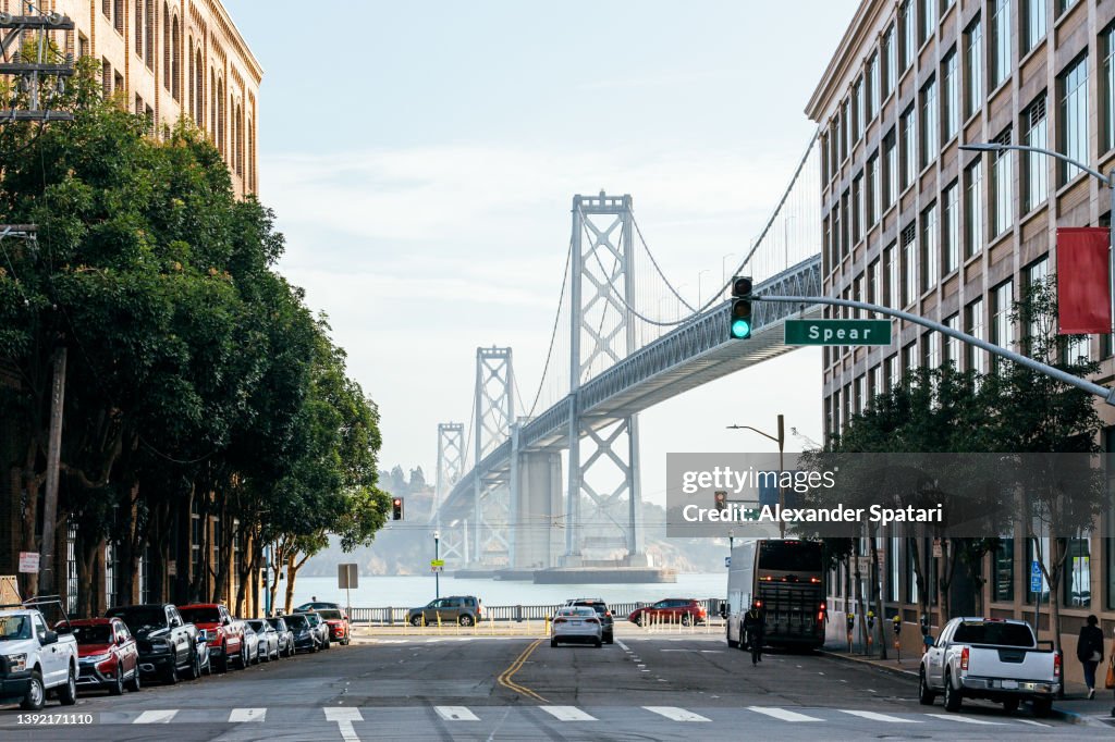 The San Francisco - Oakland Bay Bridge and street in San Francisco, California, USA