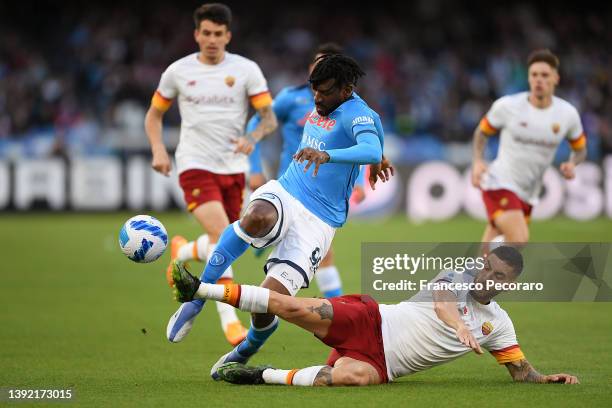 Andre-Frank Zambo Anguissa of Napoli is challenged by Lorenzo Pellegrini of AS Roma during the Serie A match between SSC Napoli and AS Roma at Stadio...