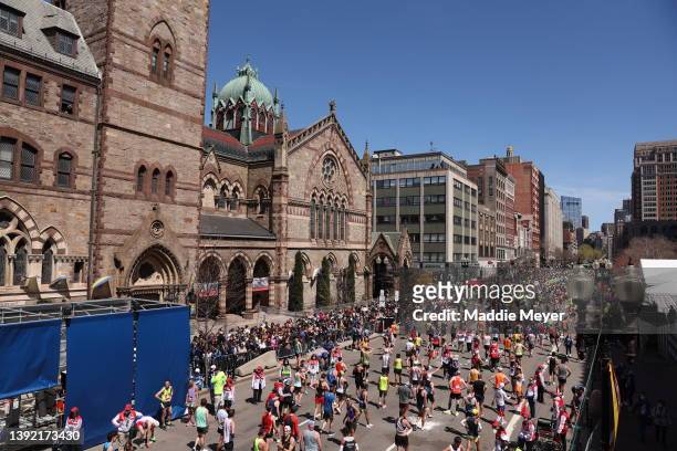 Runners walk down Boylston Street after finishing the 126th Boston Marathon on April 18, 2022 in Boston, Massachusetts.