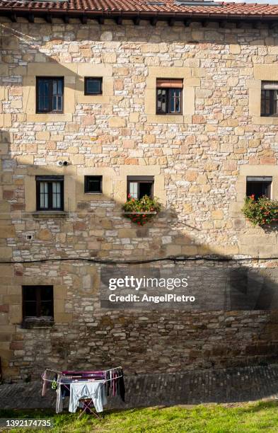 laundry hanging outside a historic building -a bit of humor in everyday life - offbeat stock pictures, royalty-free photos & images