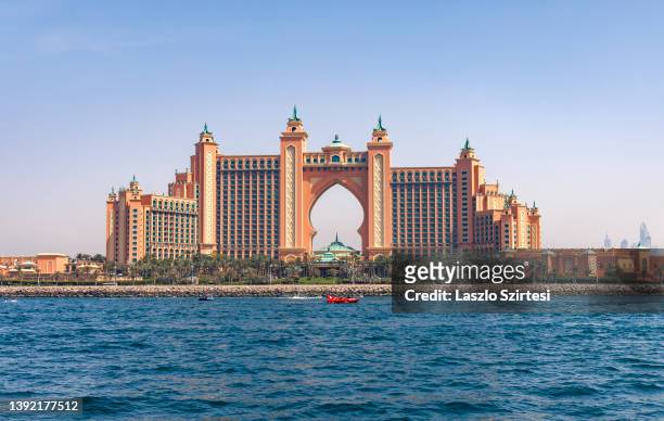 Boat passes before the Atlantis The Palm Hotel at The Palm Jumeirah on April 9, 2022 in Dubai, United Arab Emirates.