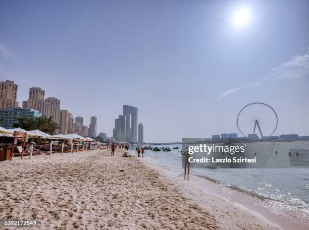 Woman takes a selfie at the JBR beach on April 10, 2022 in Dubai, United Arab Emirates.
