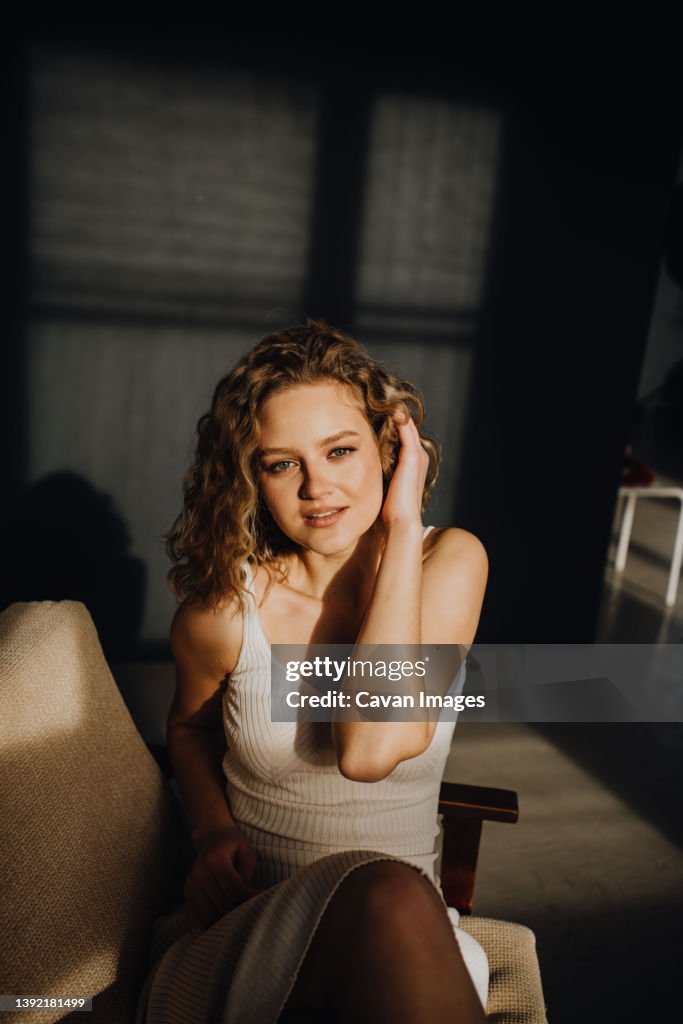 Woman in white dress in room