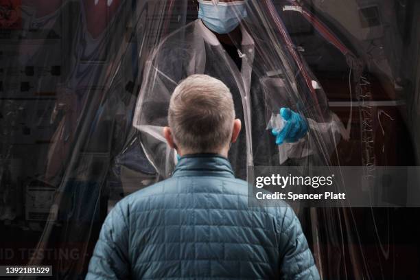 Medical worker administers tests at a Covid-19 testing site in Brooklyn on April 18, 2022 in New York City. New York City's infection numbers have...