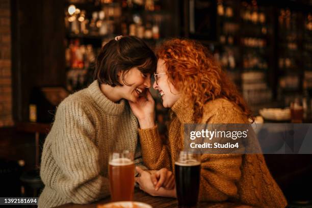 kissing with a nose - lesbian couple stock pictures, royalty-free photos & images