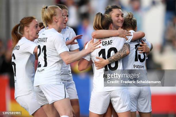 Isabel Kerschowski of 1. FFC Turbine Potsdam celebrates with teammates after scoring their side's first goal from a penalty during the Women's DFB...
