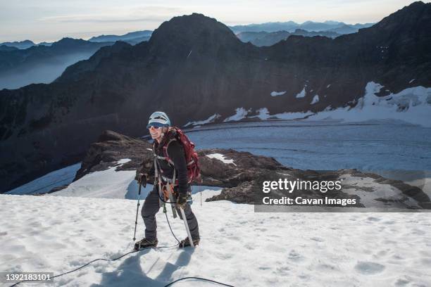 a woman climbing the blue glacier route on mount olympus - mount-olympus-olympic-national-park stock pictures, royalty-free photos & images