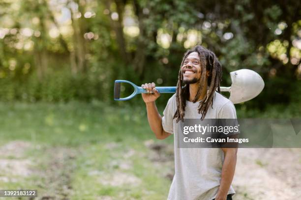 joyful black farmer looks toward the sky on his farm in bridgeport, ct - bridgeport connecticut fotografías e imágenes de stock