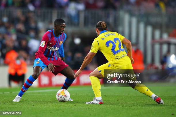 Ousmane Dembele of Barcelona is marked by Alfonso Espino of Cadiz during the LaLiga Santander match between FC Barcelona and Cadiz CF at Camp Nou on...