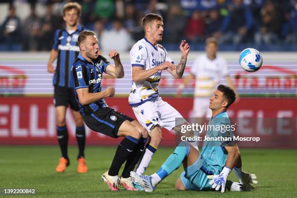 Teun Koopmeiners of Atalanta deflects the ball past his goalkeeper Juan Musso of Atalanta after Ivan Ilic of Hellas Verona's shot was parried during...