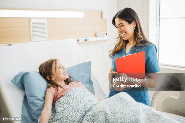 little girl in hospital bed - pediatric nurse stock pictures, royalty-free photos & images