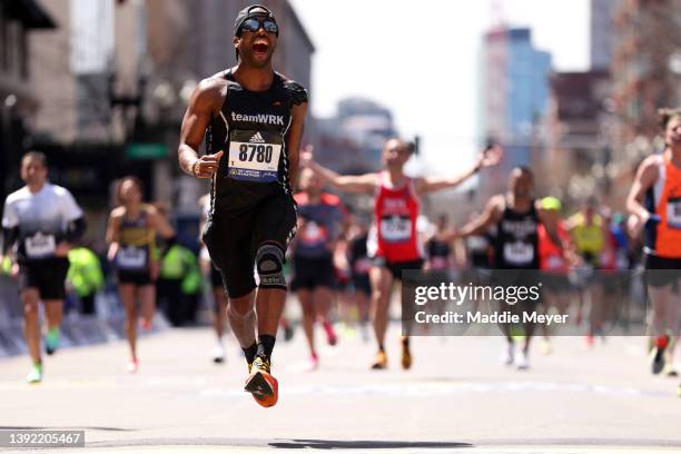 Stanley Bazile crosses the finish line during the 126th Boston Marathon on April 18, 2022 in Boston, Massachusetts.