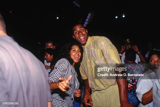 Magic Johnson of the United States Basketball Team and his wife Cookie Johnson dance during the 1992 Olympics in Barcelona, Spain. NOTE TO USER: User...