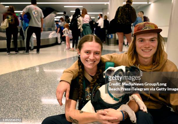 Los Angeles, CA L-R Shane O"u2019Malley, Alex Brown and their canine companion Kenobi flew into LAX from Salt Lake City and had actually read that...