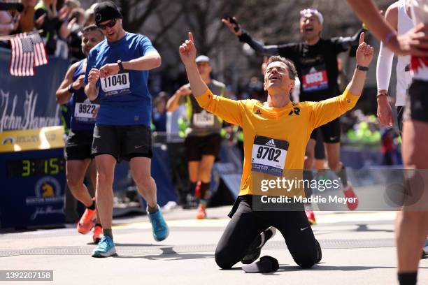 Claudio Guther celebrates after crossing the finish line during the 126th Boston Marathon on April 18, 2022 in Boston, Massachusetts.