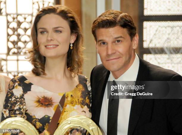 Emily Deschanel and David Boreanaz pose as "Bones" celebrates their 100th episode milestone party held at 20th Century Fox Studios on January 26,...