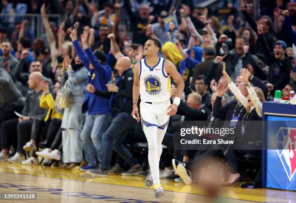 Jordan Poole of the Golden State Warriors reacts after he made a three-point basket against the Denver Nuggets in the first half during Game Two of...