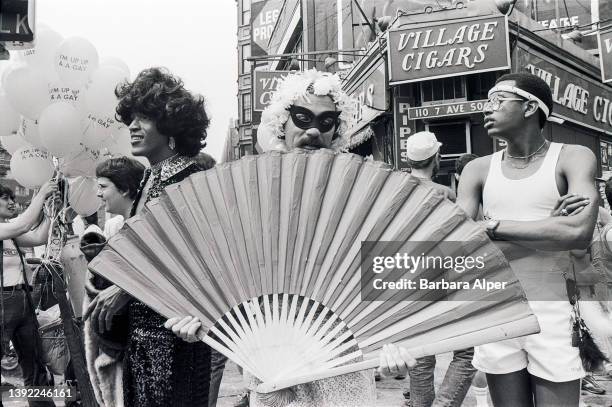 View of participants in Pride March on the corner of Christopher Street and 7th Avenue, New York, New York, June 27, 1982. Among those visible is...