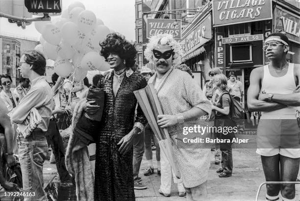 American gay liberation activist Marsha P Johnson , along with unidentified others, on the corner of Christopher Street and 7th Avenue during the...