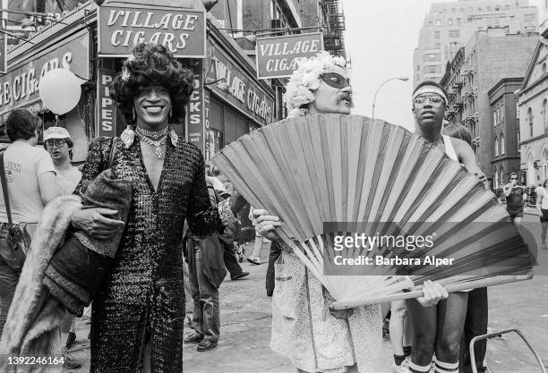 American gay liberation activist Marsha P. Johnson , along with unidentified others, on the corner of Christopher Street and 7th Avenue during the...