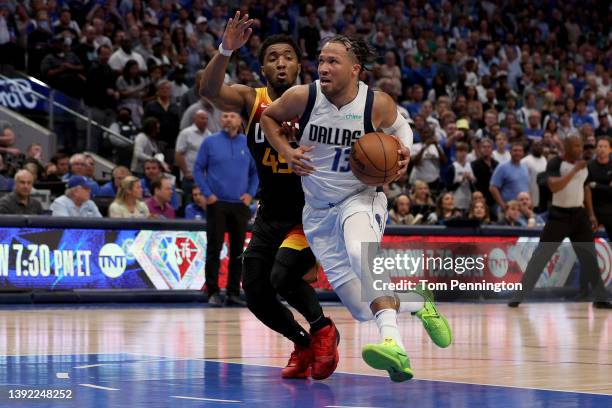 Jalen Brunson of the Dallas Mavericks drives to the basket against Donovan Mitchell of the Utah Jazz in the fourth quarter of Game Two of the Western...