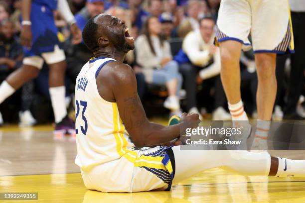Draymond Green of the Golden State Warriors reacts after he drew an offensive foul on Aaron Gordon of the Denver Nuggets in the first half during...