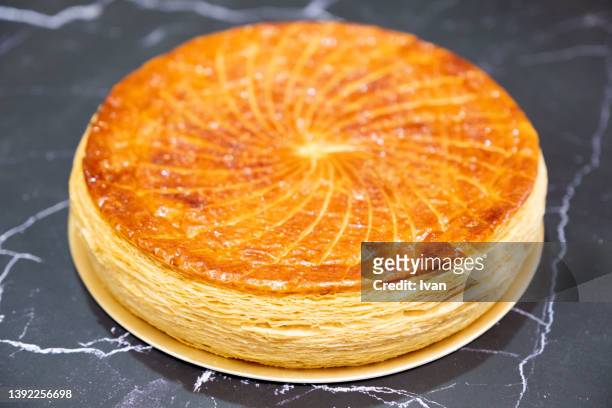 french galette des rois pastry eaten on epiphany - king cake stock pictures, royalty-free photos & images