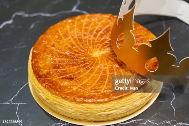 french galette des rois pastry eaten on epiphany - galette fotografías e imágenes de stock