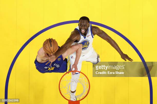 Draymond Green of the Golden State Warriors and Nikola Jokic of the Denver Nuggets go for a rebound during Game Two of the Western Conference First...