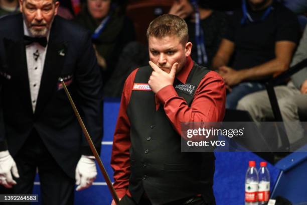 Michael White of Wales reacts in the first round match against Mark Williams of Wales on day three of the 2022 Betfred World Snooker Championship at...