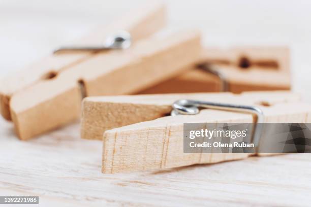 heap of wooden cothespins. - peg stock pictures, royalty-free photos & images