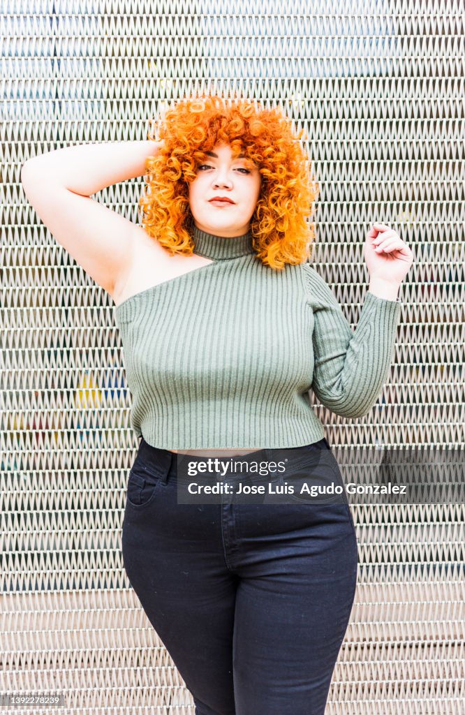 Portrait of smiling chubby redhead young woman, portrait of chubby redhead woman outdoors, very cute redhead chubby girl lifestyle.