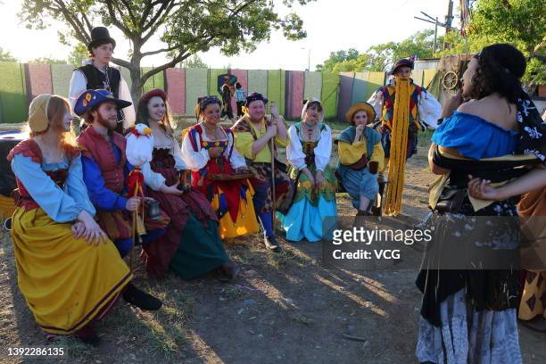 People in traditional costumes enjoy themselves during Renaissance Pleasure Faire on April 17, 2022 in Irwindale, California.