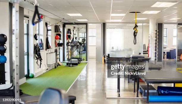 interior of rehabilitation center with therapeutic equipment - physical therapy stock pictures, royalty-free photos & images