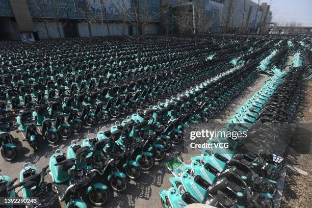 Shared electric bicycles of Qingju, the bike-sharing unit of Chinese ride-hailing giant Didi Chuxing, are seen at a parking lot on April 18, 2022 in...