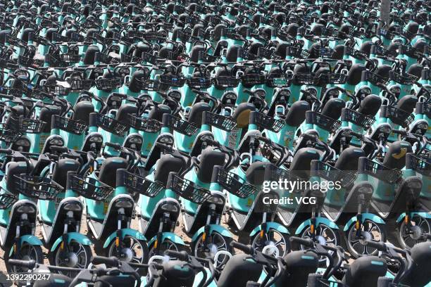 Shared electric bicycles of Qingju, the bike-sharing unit of Chinese ride-hailing giant Didi Chuxing, are seen at a parking lot on April 18, 2022 in...