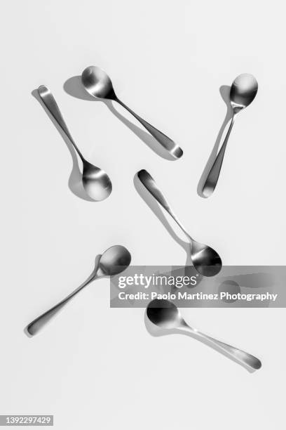 directly above shot of spoons on white background - biella stock pictures, royalty-free photos & images