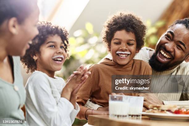 guarda i nostri baffi al latte! - drinking milk foto e immagini stock