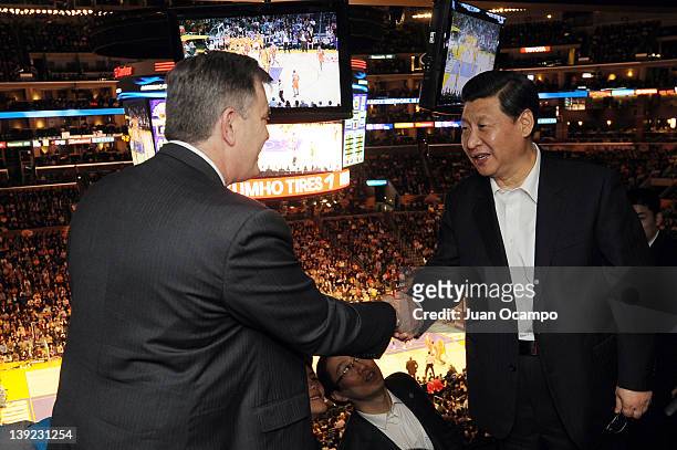 President and CEO of AEG Tim Leiweke greets Chinese Vice President Xi Jinping during a game between the Phoenix Suns and the Los Angeles Lakers at...